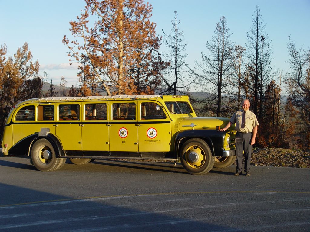 Leslie Quinn in front of a historic Yellow Bus