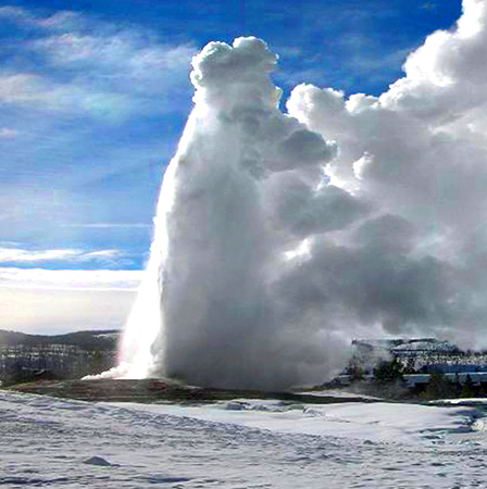 Old Faithful geyser during winter