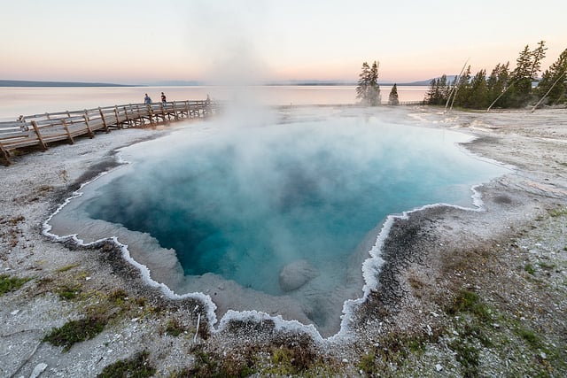 Family enjoying a sunset near Black Pool in West Thumb Geyser Basin