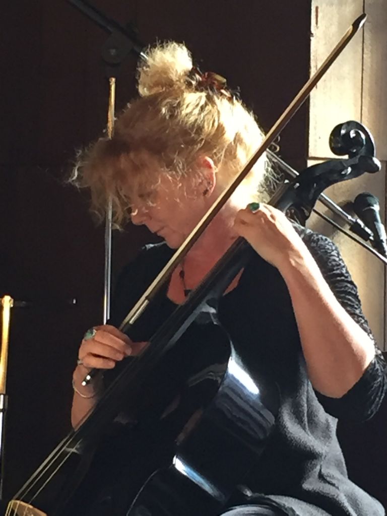 Musician Martha Colby plays at Yellowstone National Park.