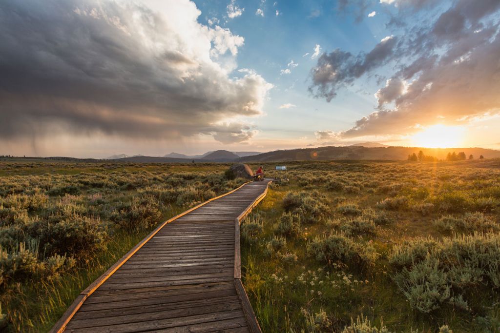 A wooden trail at sunset.