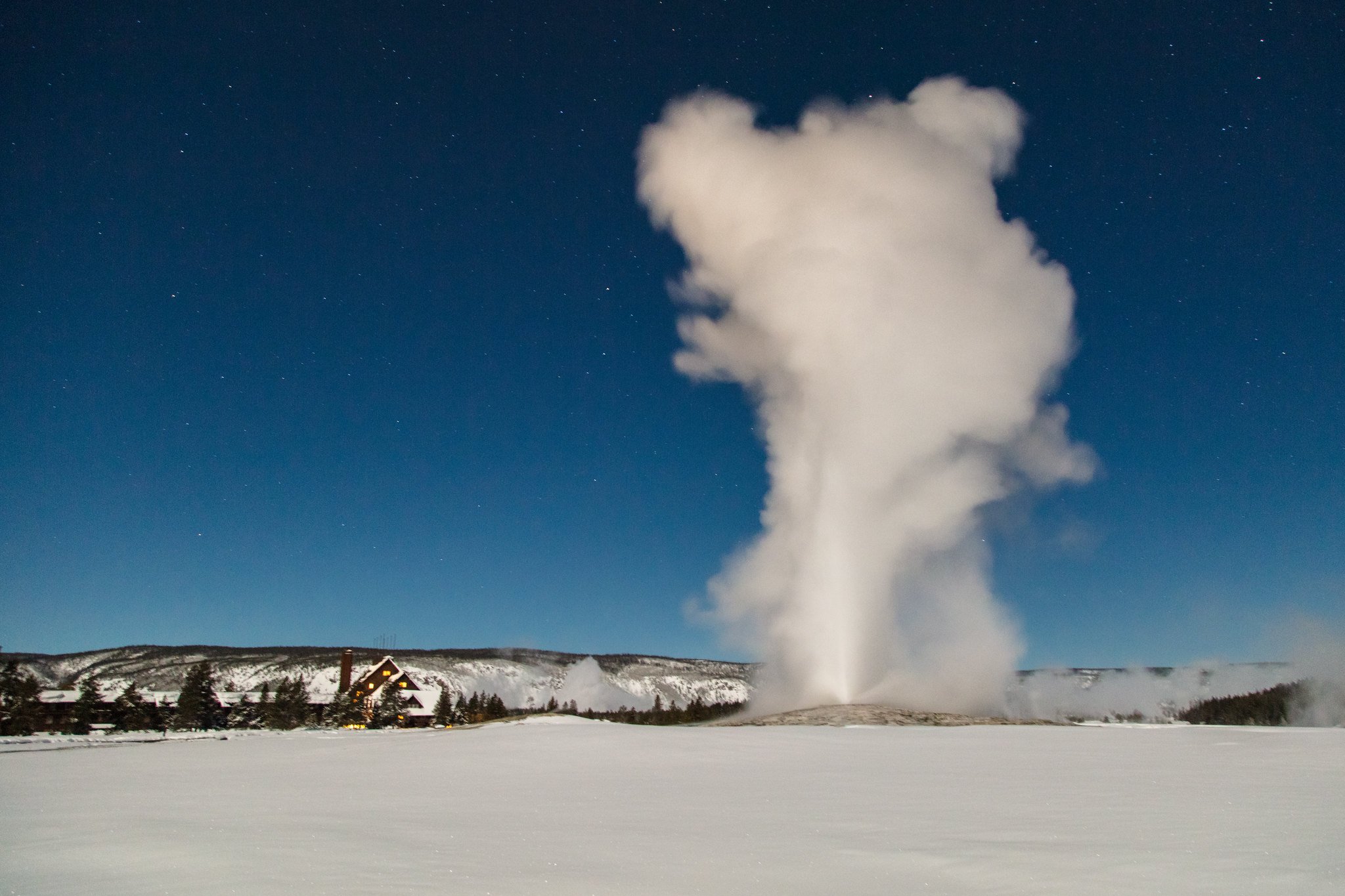 Old Faithful under a winter full moon