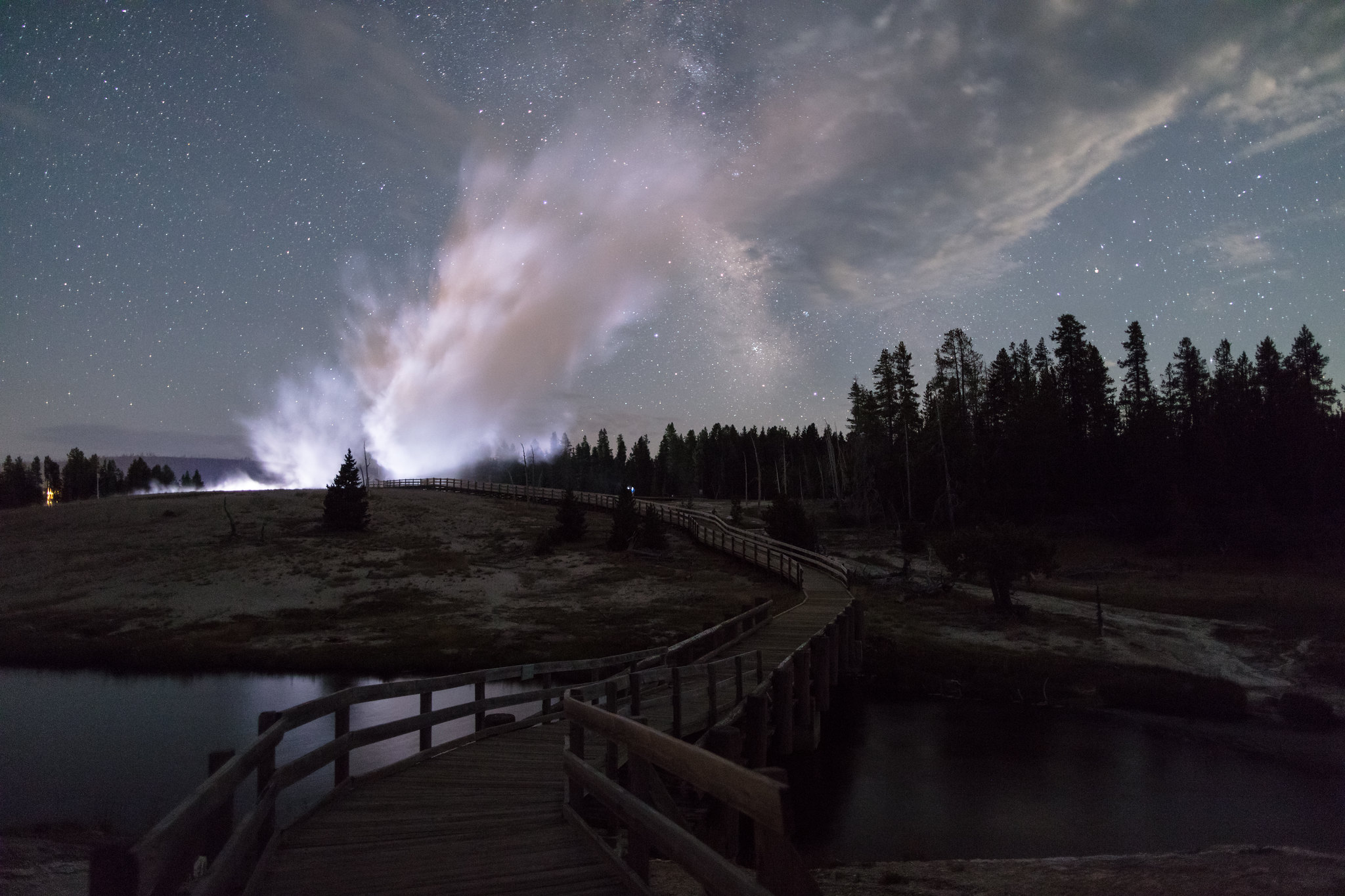 Castle Geyser night eruption with Milky Way