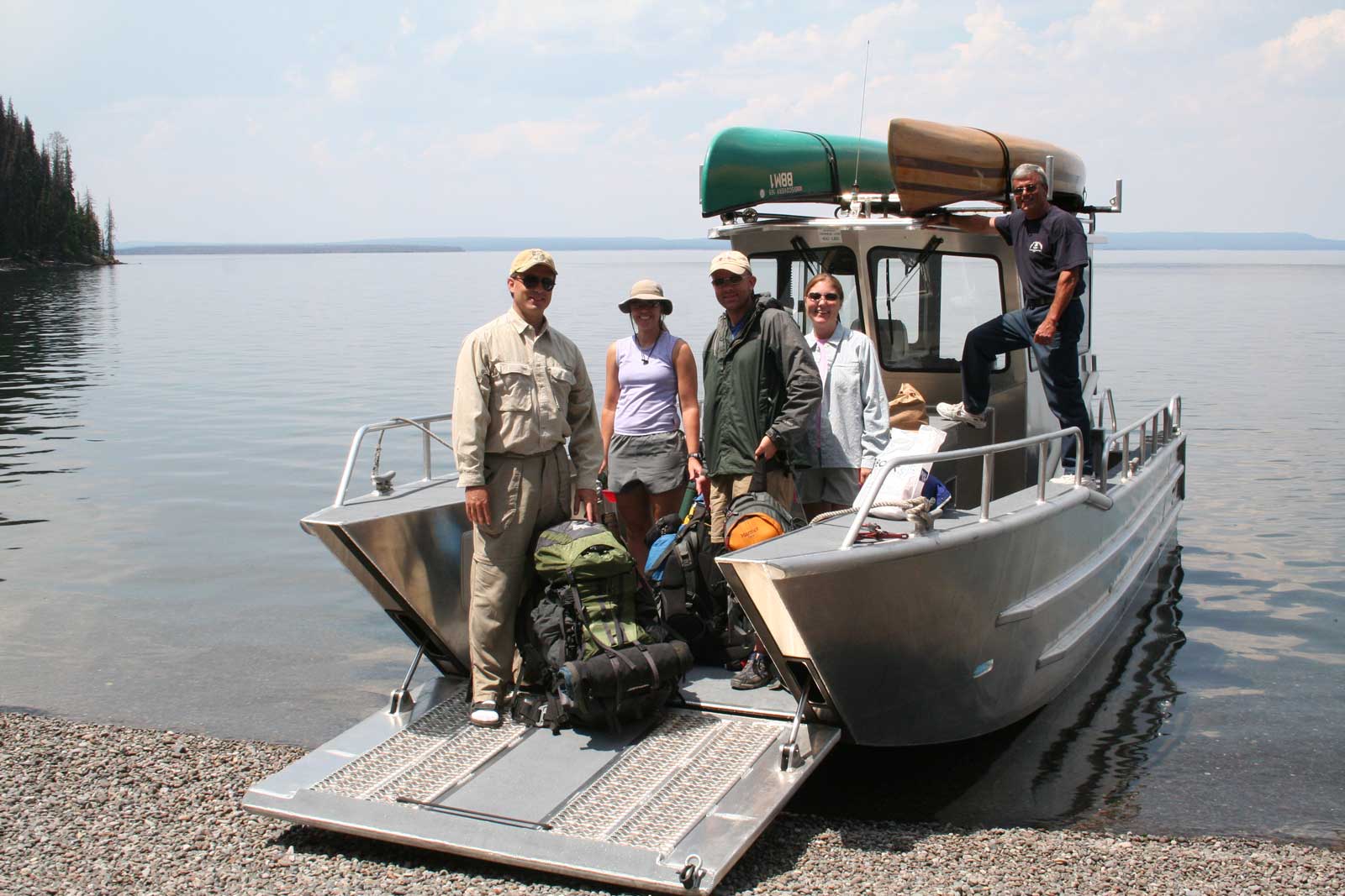 Group of people posing on a boat