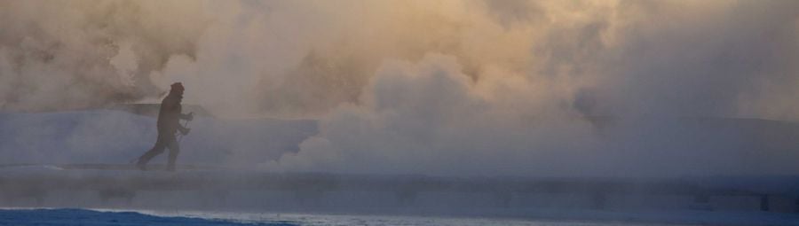 A Skier passing Thermals close to Old Faithful
