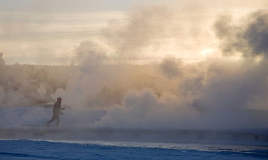 A Skier passing Thermals close to Old Faithful