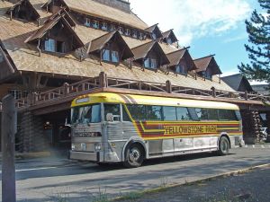 Yellowstone Park Bus departing Old Faithful Inn