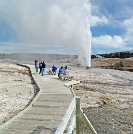 Crowd on boardwalk watching Behive geyser