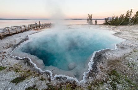 Family enjoying a sunset near Black Pool in West Thumb Geyser Basin