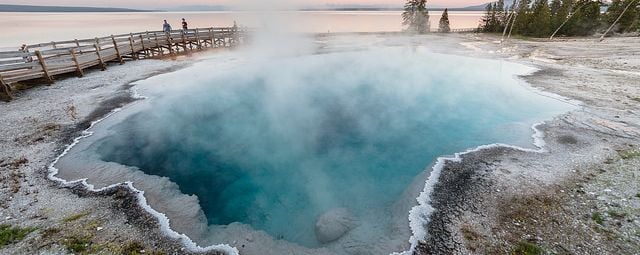 Family enjoying a sunset near Black Pool in West Thumb Geyser Basin