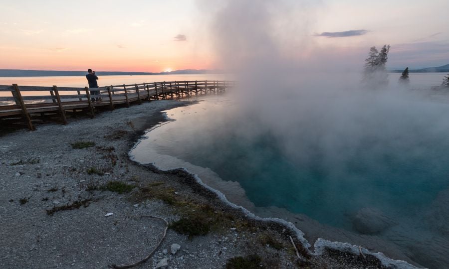 Photographing the sunrise at West Thumb Geyser Basin