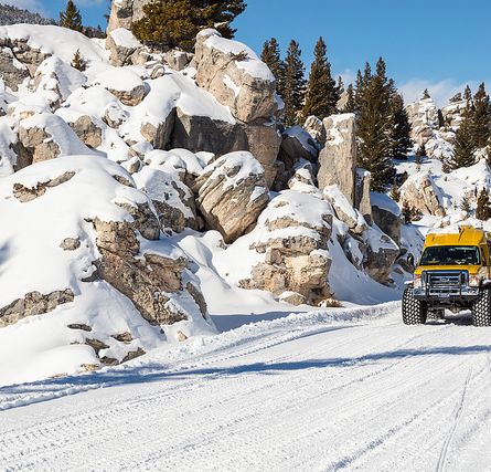 Snowcoach riding through the Hoodoos