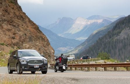 Visitors driving on East Entrance Road up Sylvan Pass