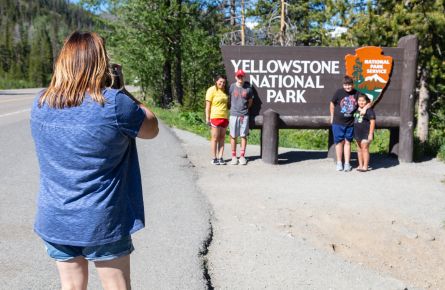 Family photo at the East Entrance park sign