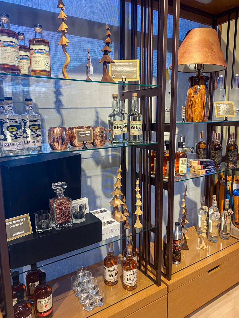 Artisan carved wood trees and Montana made spirits at at Mammoth Hotel Gift Shop