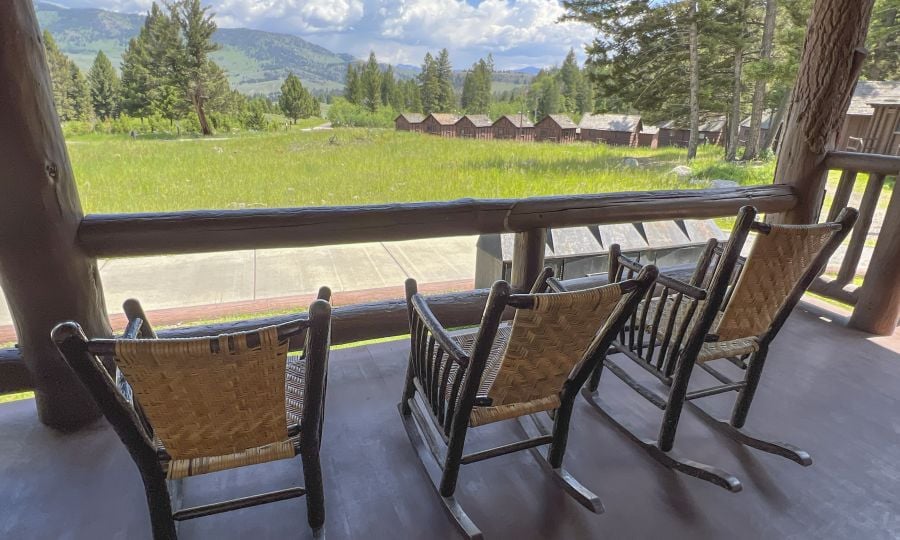 Three rocking chairs on the porch of Roosevelt Lodge