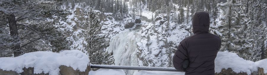Person at artist's point in winter at the grand canyon of the yellowstone