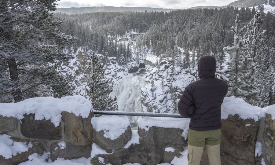 Person at artist's point in winter at the grand canyon of the yellowstone